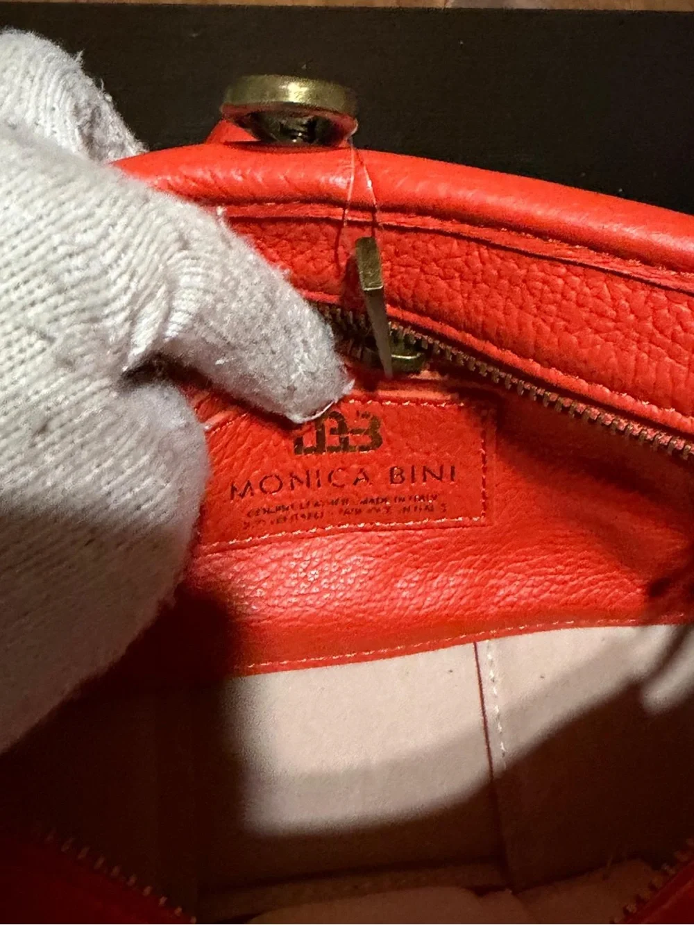 Monica Bini Orange pebbled small shoulder bag zip closure gold chain strap.
